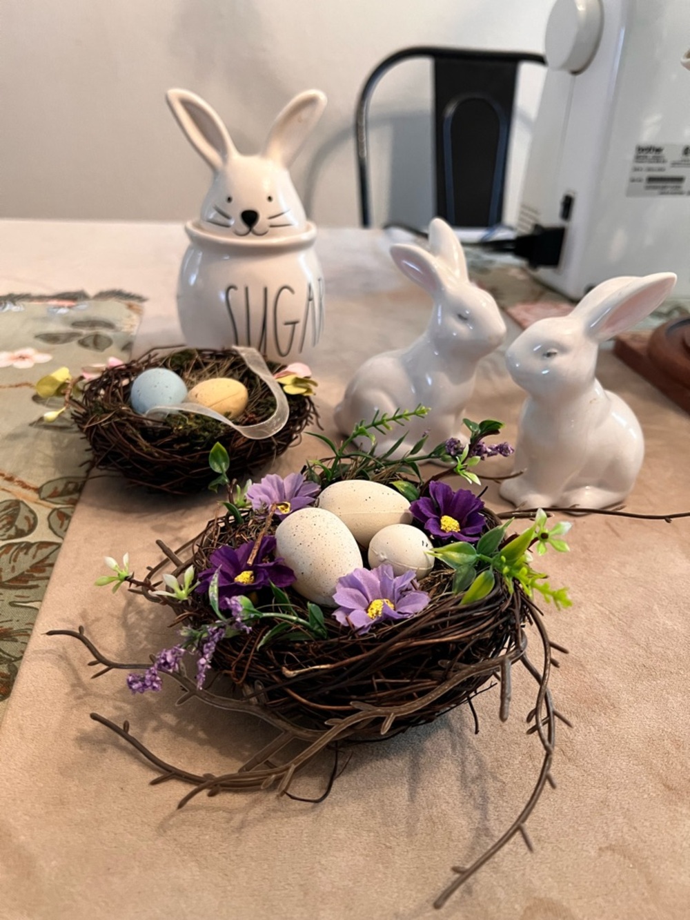Easter Nest Centerpiece with Purple Flowers and Speckled Eggs